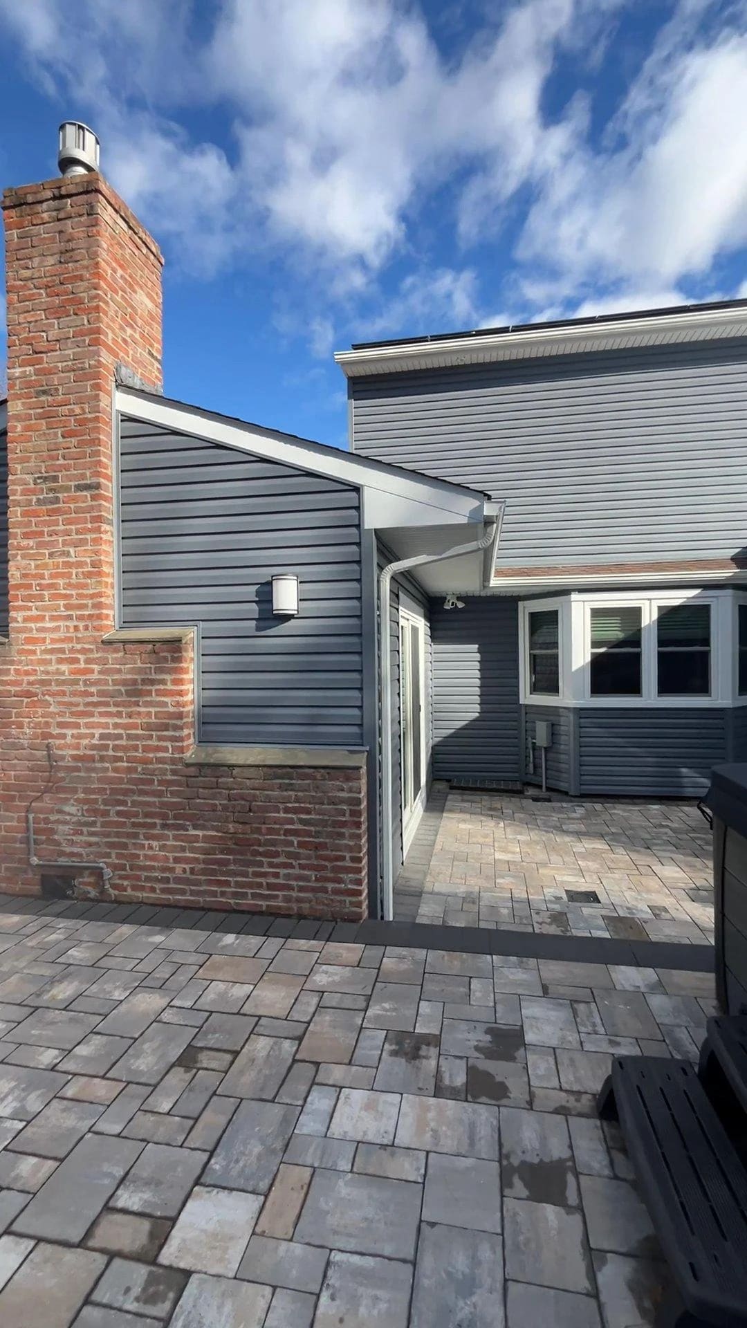 Brick chimney and patio at the renovated home