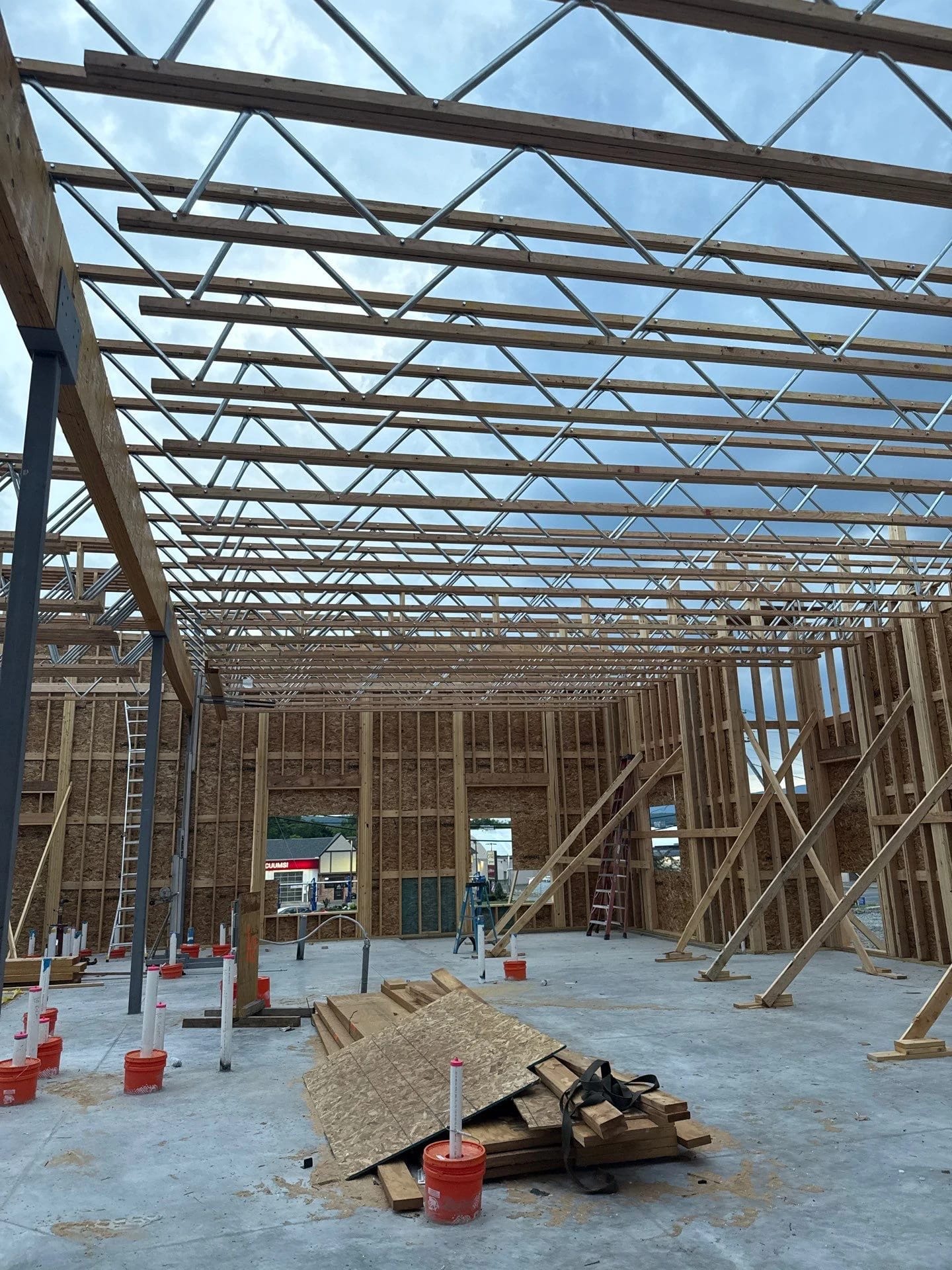 Roof truss framing in progress.