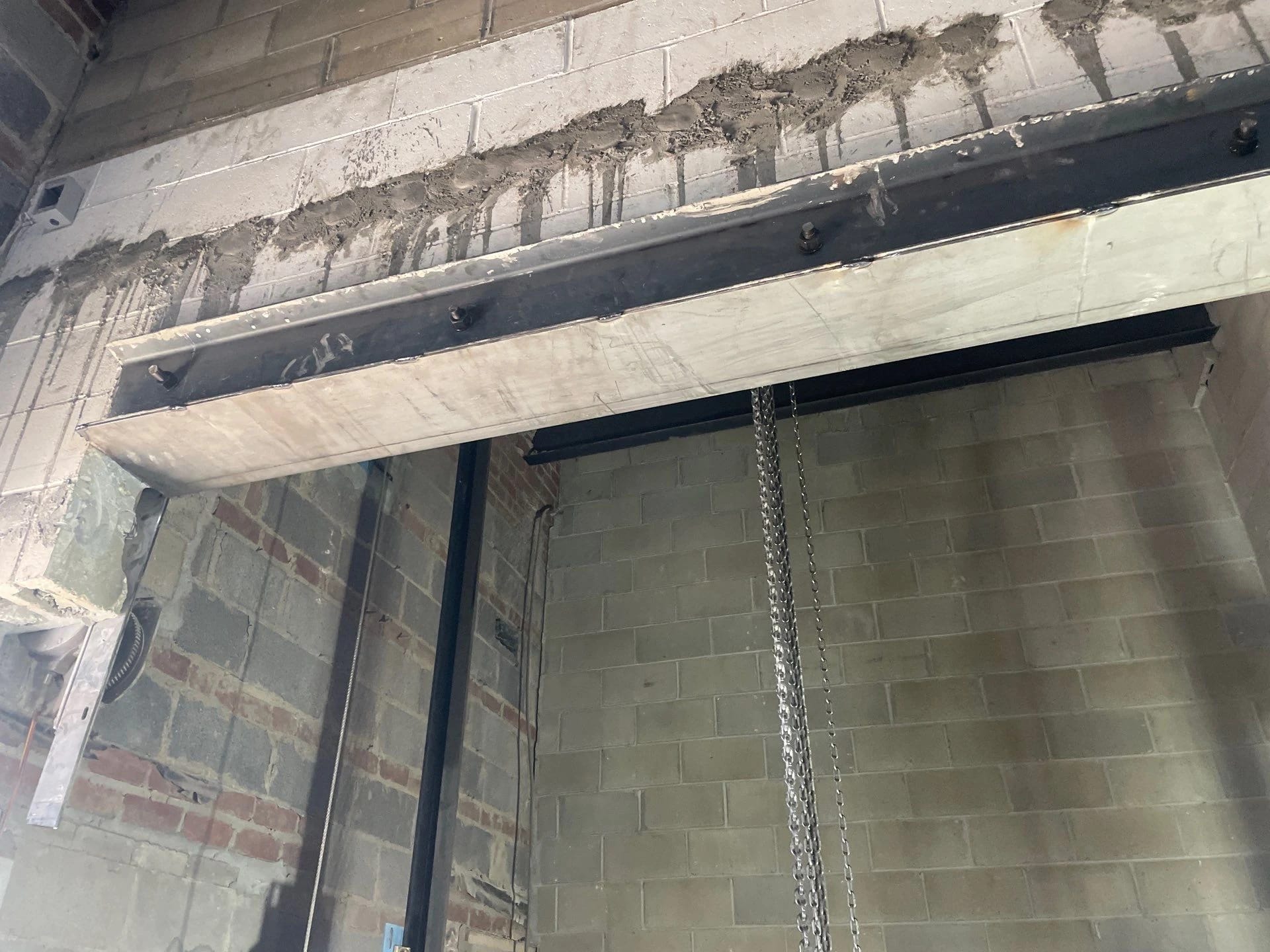Interior masonry header at elevator shaftway.
