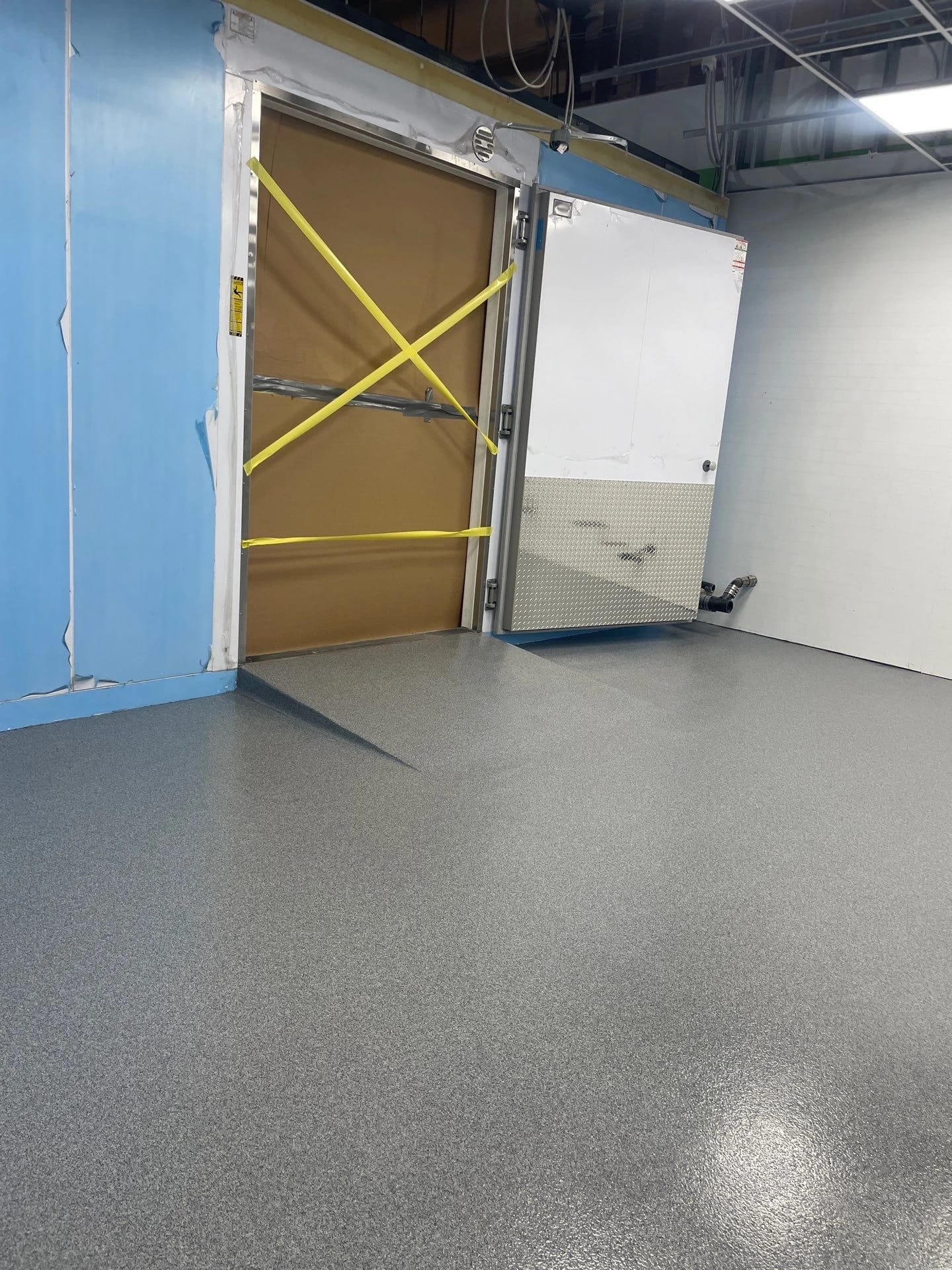 Bakery walk in cooler with epoxy entry ramp.