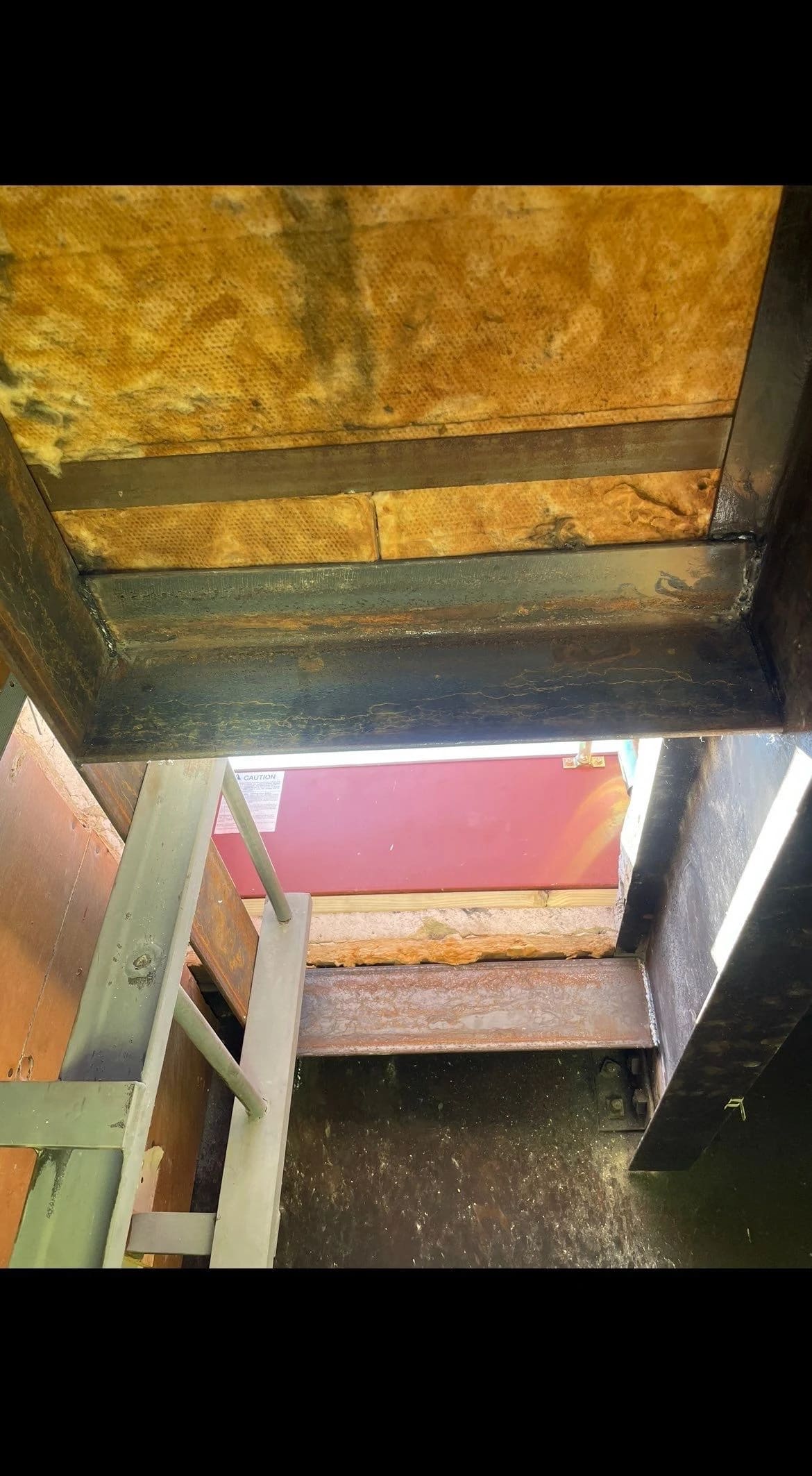 Installation of miscellaneous steel for roof hatch.