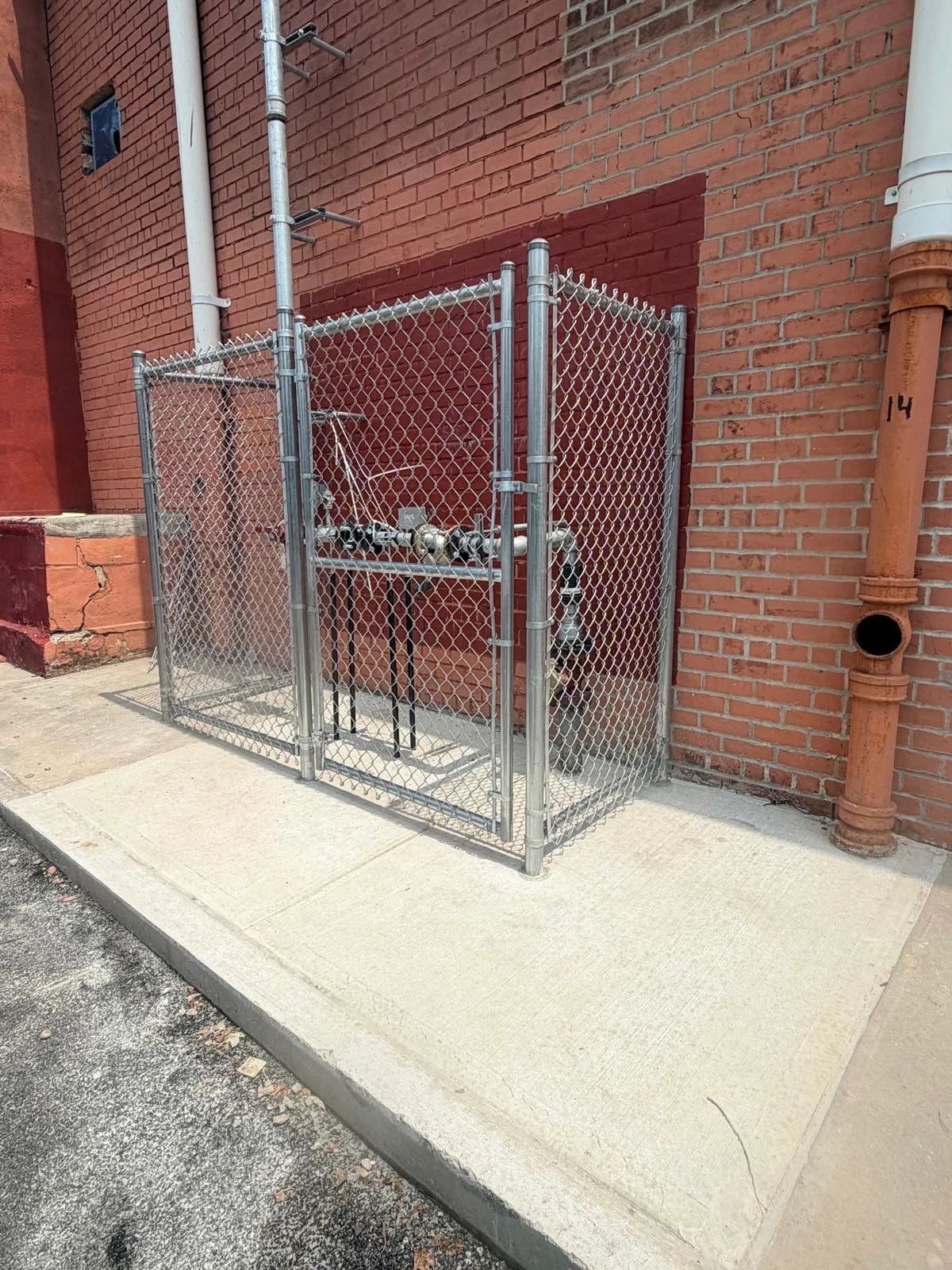 Fence enclosure at gas meter.