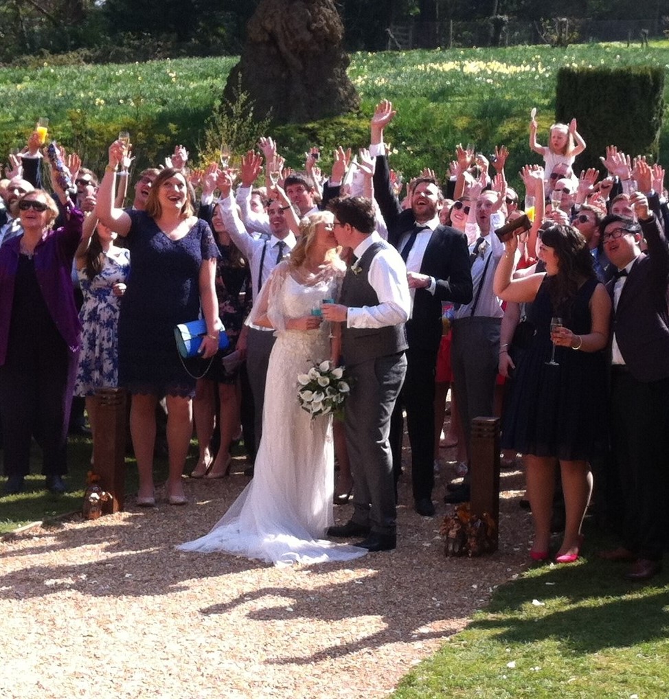 a group of people enjoying a wedding