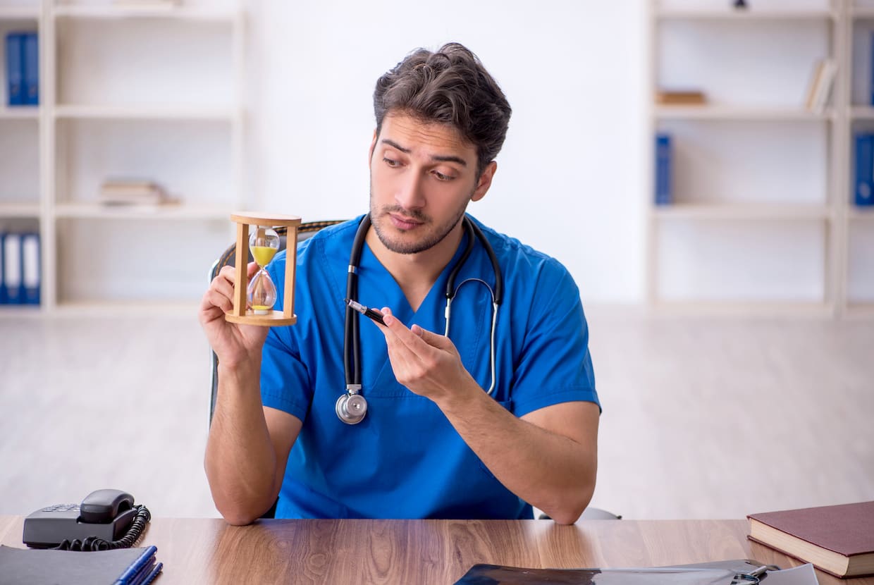 a medical professional showing an hourglass