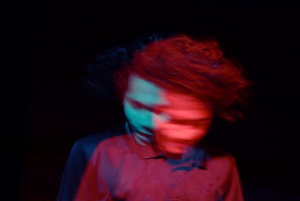 a motion-blurred image of a dizzy man