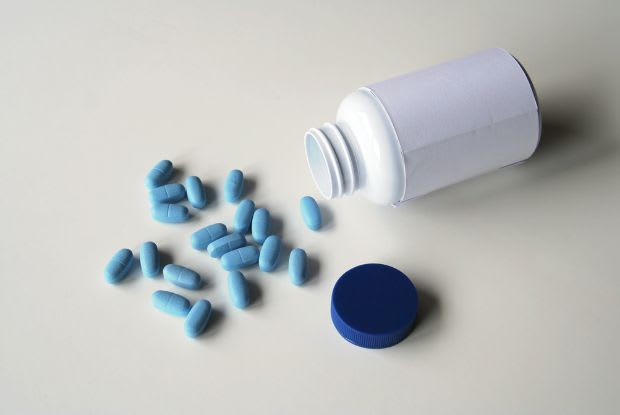 Viagra spilling out of a prescription bottle