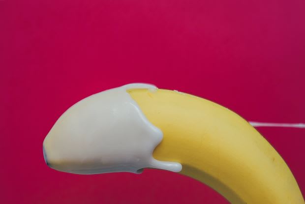 a banana with yogurt on the tip as a phallic symbol