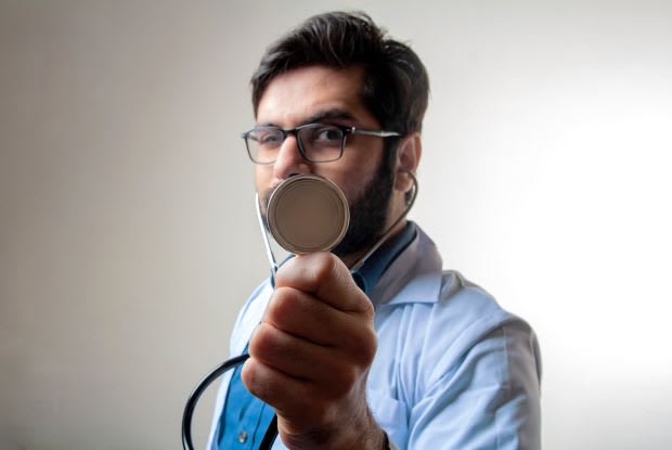 a doctor holding a stethoscope