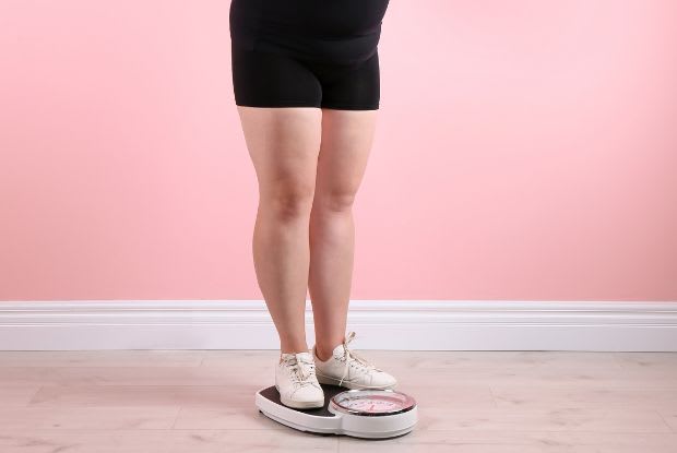 woman standing on a scale