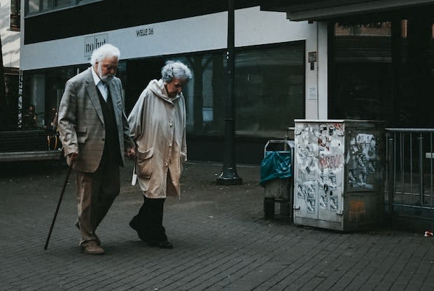 an older couple walking together