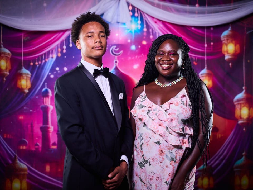 Students dressed in formal attire celebrate together at the End-of-Term Bash.