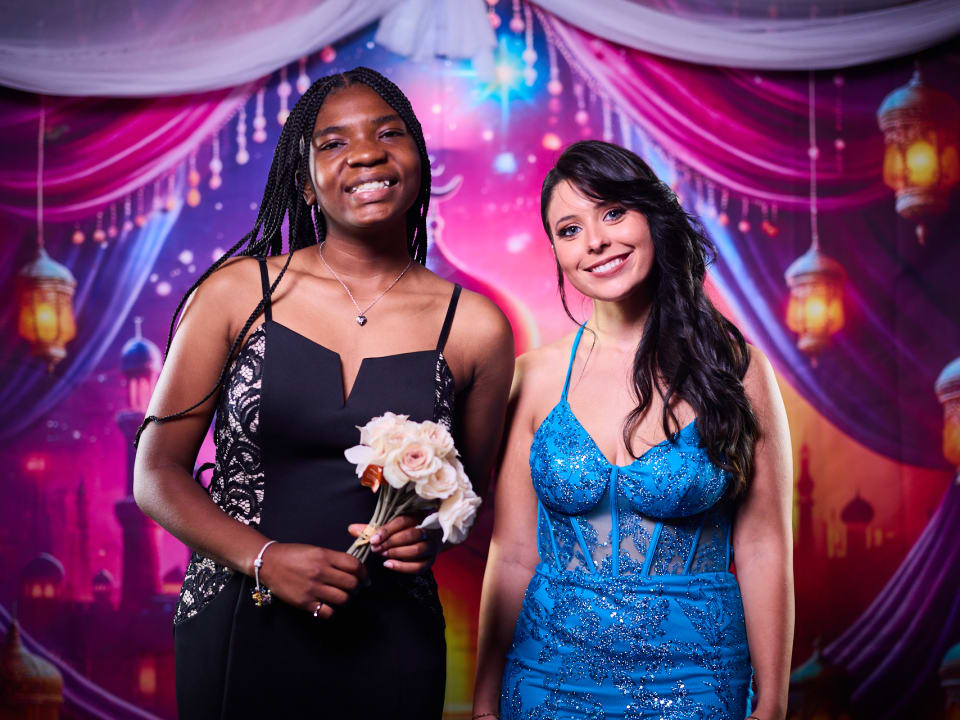 Students pose cheerfully together in formal attire during the End of Term Bash event.