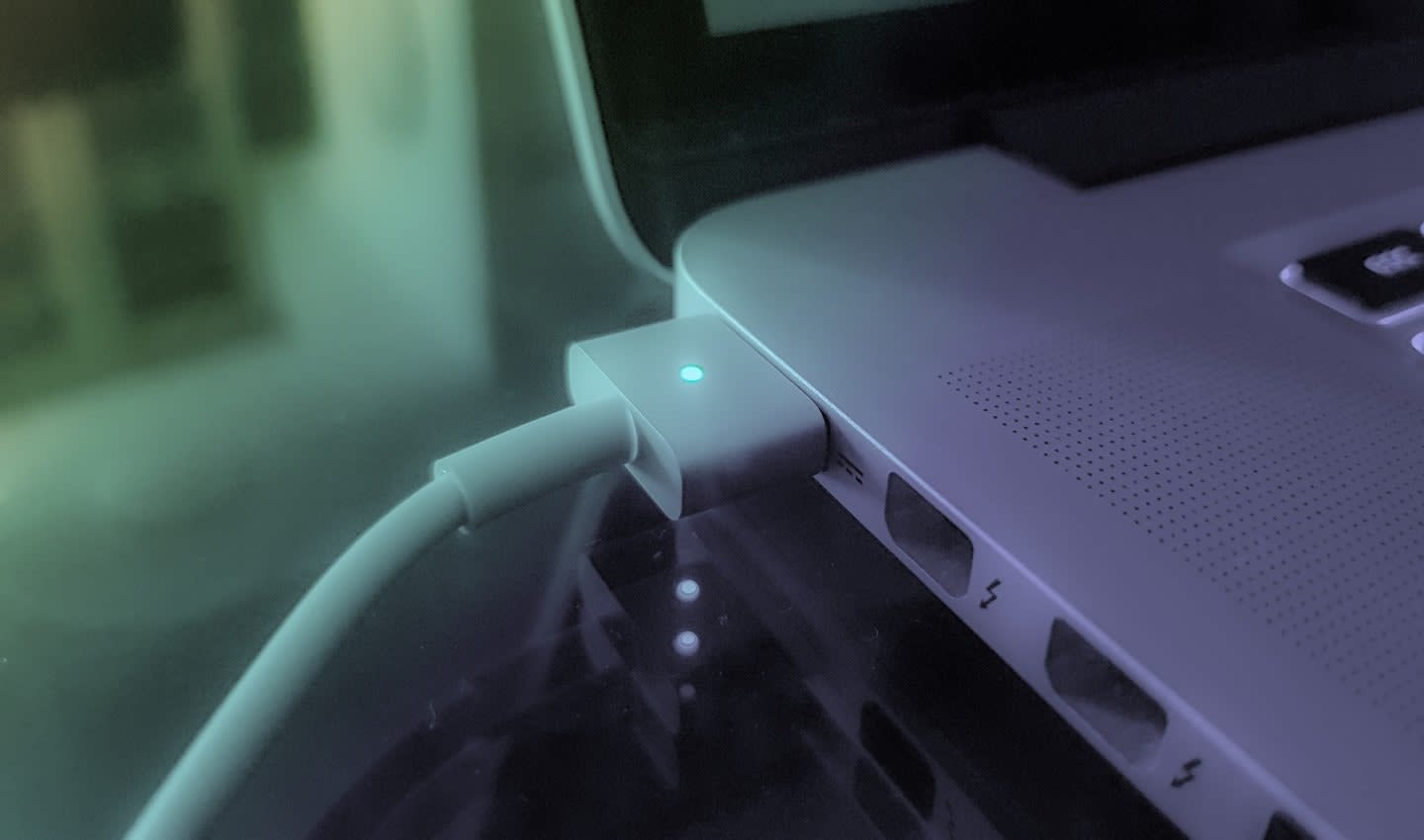 Apple Macbook laptop plugged in and charging