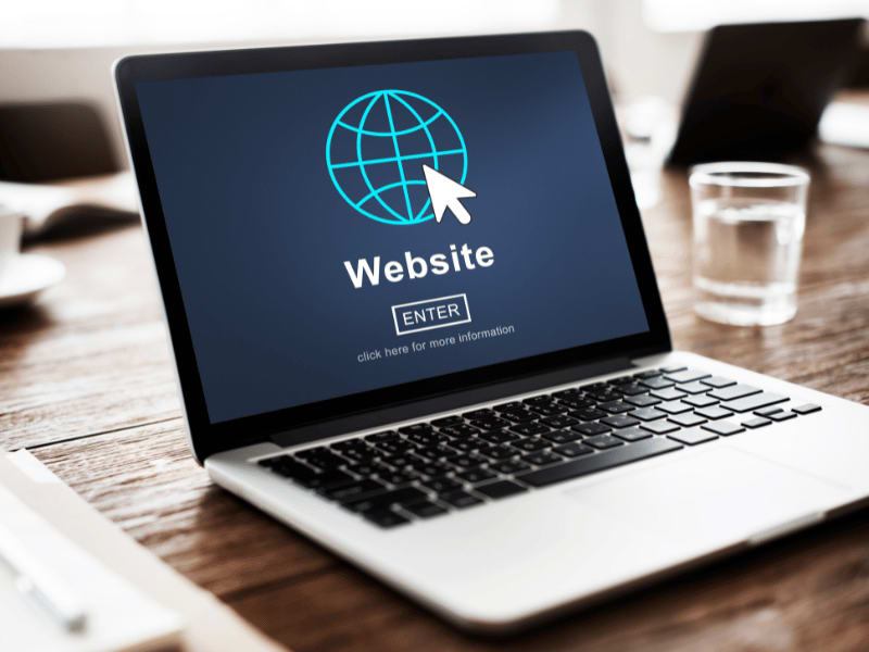Laptop screen showing a web browser and website icon, indicating browser-related internet issues.