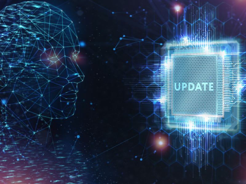 Digital human face with glowing circuitry and a chip labeled “Update,” representing system security updates