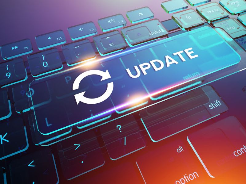 Futuristic keyboard with a glowing 'Update' key and a sync icon