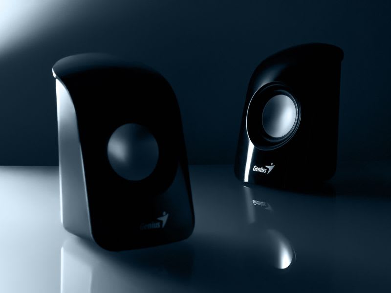 Black desktop speaker with a glowing purple LED setup and Gigabyte branding