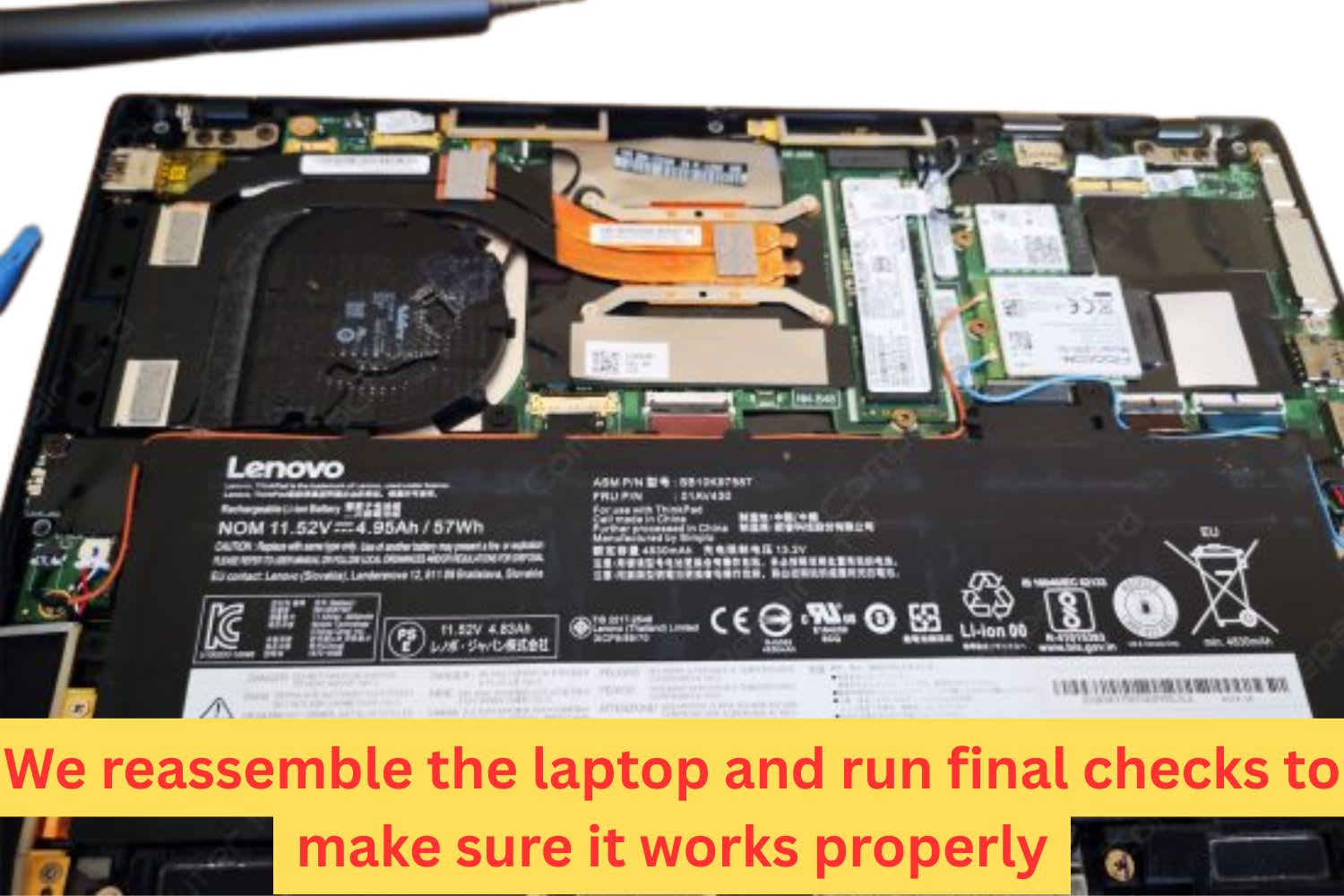 Internal view of a Lenovo laptop motherboard with battery, fan, SSD, and cooling system exposed for diagnostics or water damage repair.
