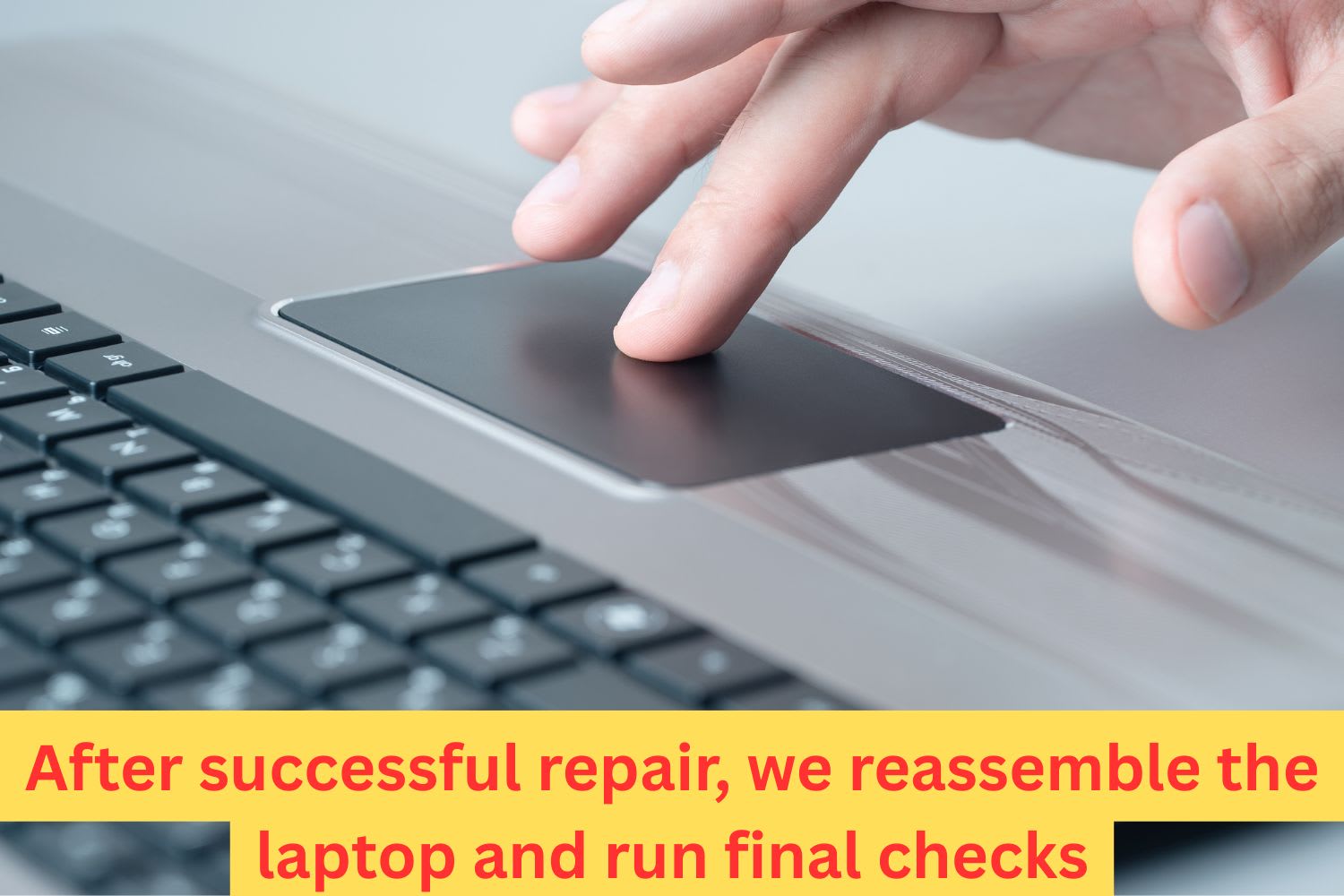 User testing the touchpad on a laptop after reassembly, confirming that the touchpad and system functions work correctly post-repair.