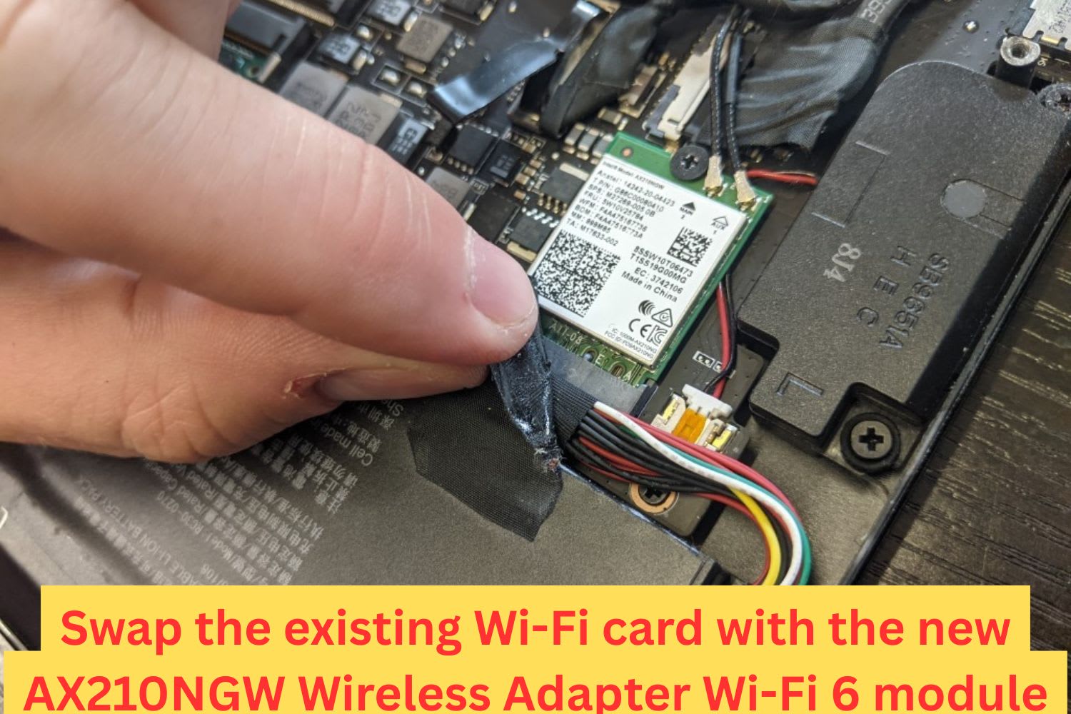 Close-up of a user swapping out the existing Wi-Fi card on a laptop motherboard with an Intel AX210NGW Wi-Fi 6 adapter for faster wireless connectivity.