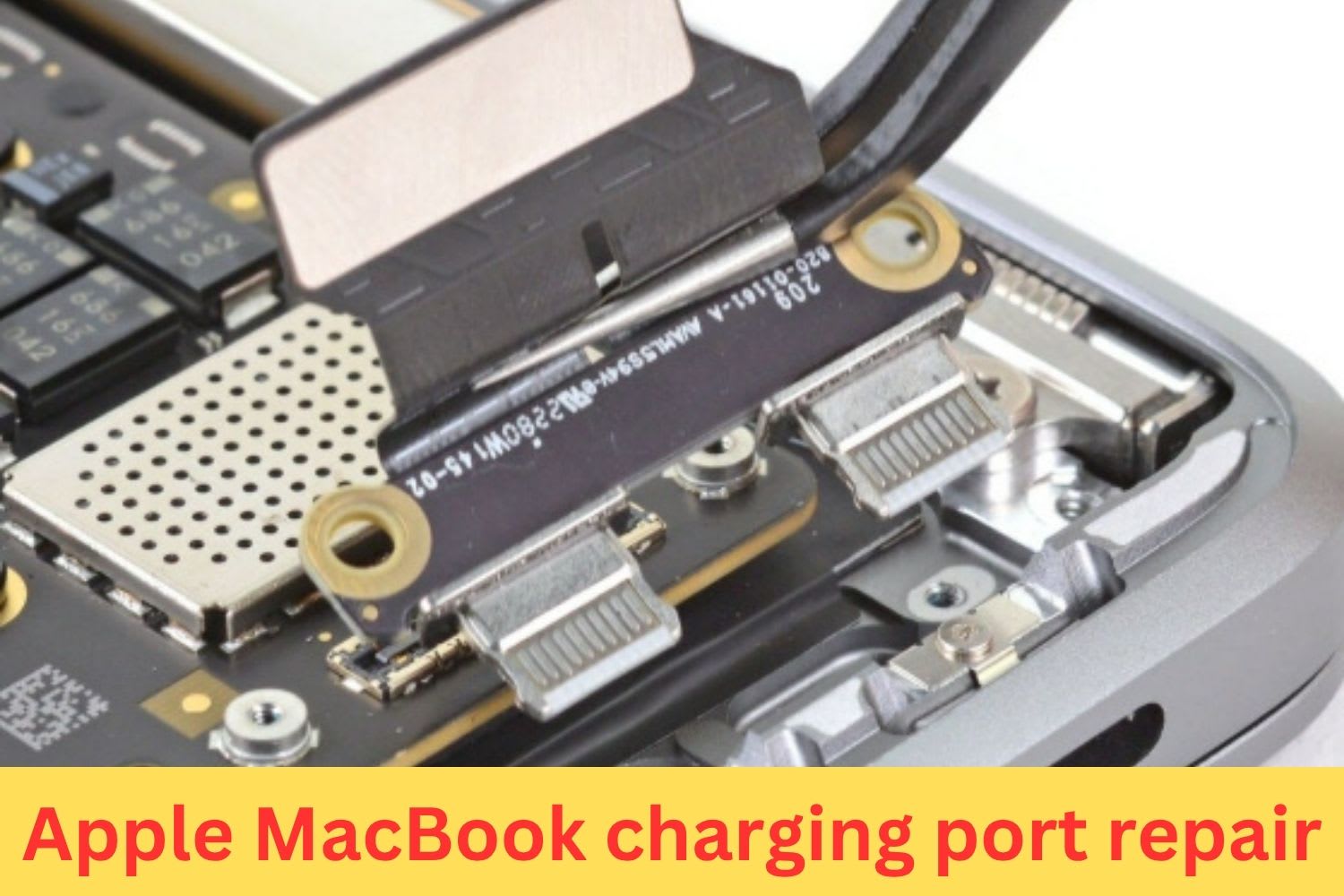 Close-up of a MacBook charging port being repaired, showing internal connector components and logic board details