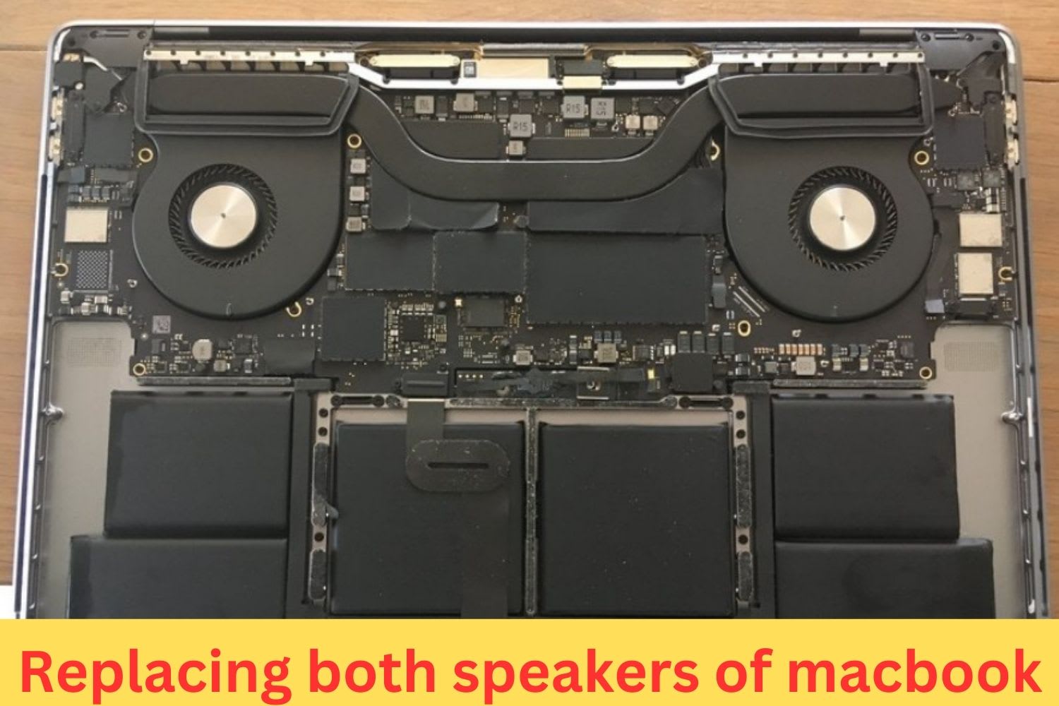 Internal view of a MacBook with both speakers exposed for replacement near the battery and logic board