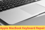Close-up of an Apple MacBook keyboard and trackpad, representing repair or replacement service for non-working keys or input issues