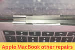 Close-up of a broken or misaligned screen hinge on an Apple MacBook, indicating the need for repair