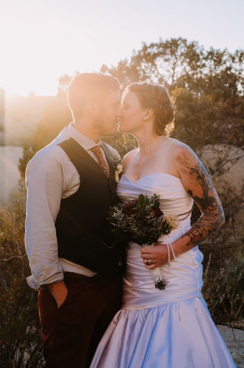 couple kissing after getting married