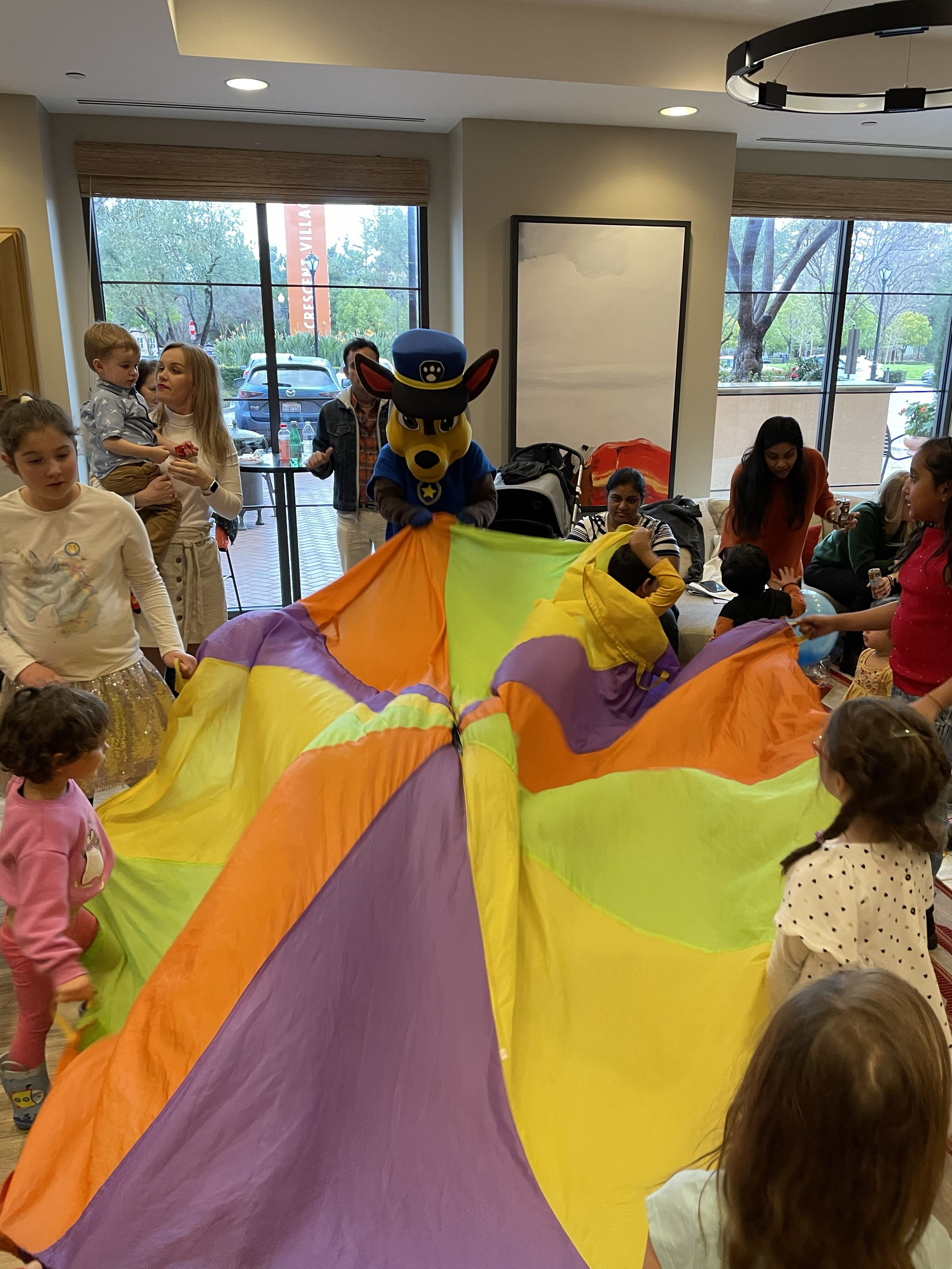 Parachute play at a Kiddo World party