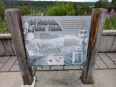 Signpost at a pullout about attempts to climb Mt. Denali in the past