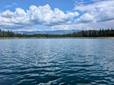 A beautiful contrast of the lake, earth, and sky
