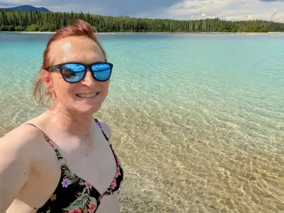 On the shore of the lake, wanting to take a dip but the bottom was very silty with a lot of sinking into it.