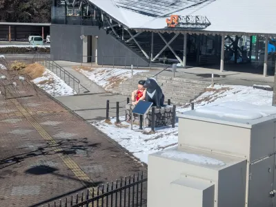 Mascot for Oyama Town in front of their train station