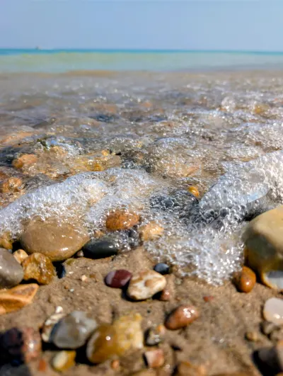 Closeup of the rocks and surf from the lake