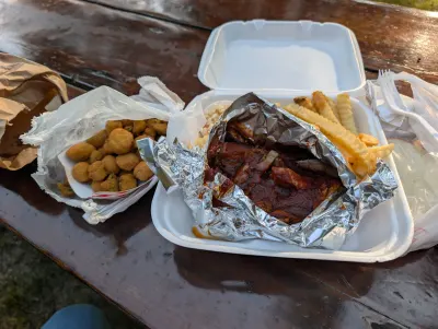 Pork shoulder dinner with fries and fried okra