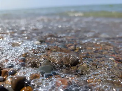 Closeup of a rocky patch with the surf washing over it