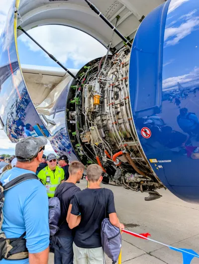 Engine cowl open of an Airbus A350 to see the inner plumbing