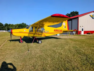 A Macchi AL60-F5 painted up as a school bus. Peanuts side.