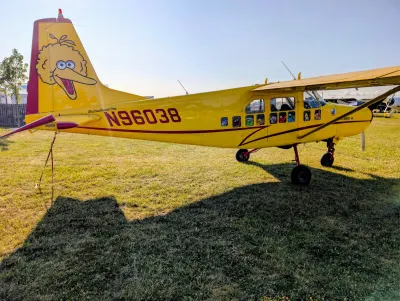 A Macchi AL60-F5 painted up as a school bus. Sesame Street side.