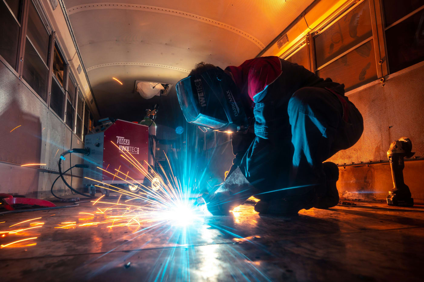 A welder at work, sparks flying