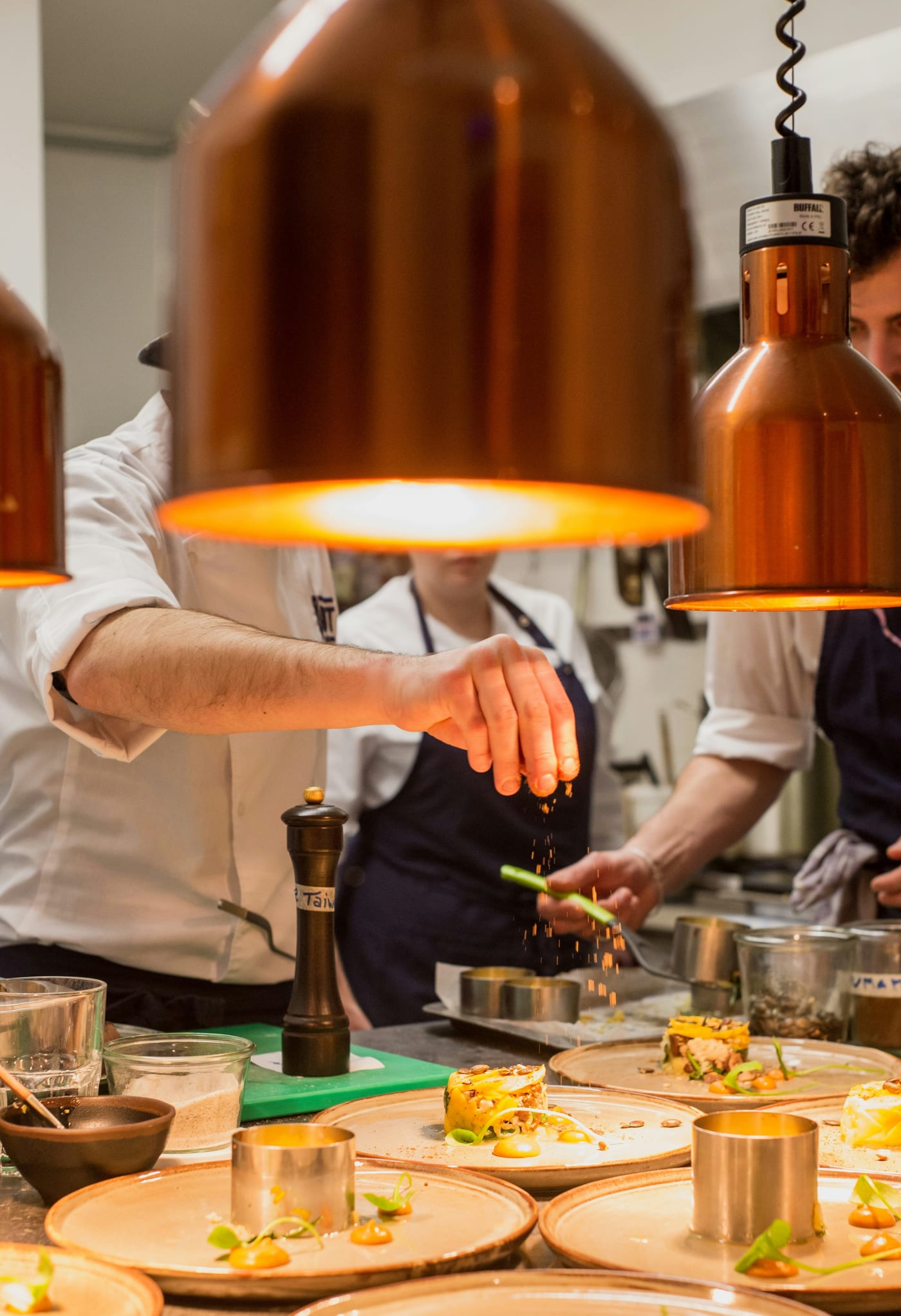 A chef plating a dish during service