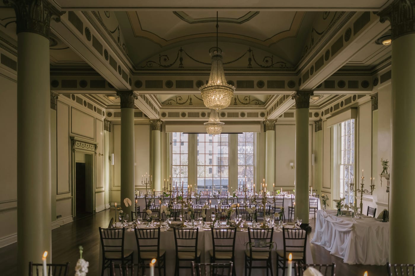 An elegant reception room set for dinner