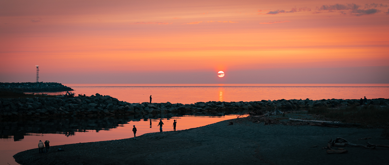 Beach scene with sunset on the St. Lawrence River