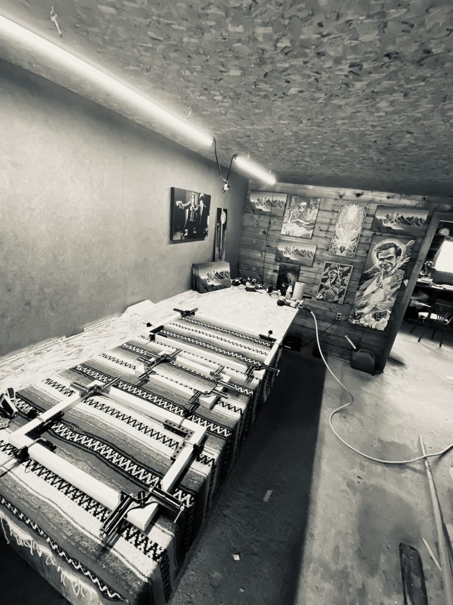 Stretcher-bar frames clamped during assembly in the studio