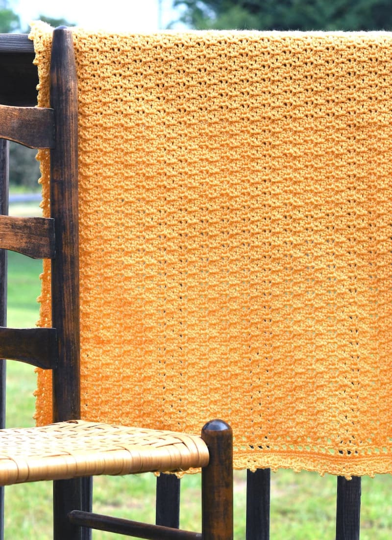 https://res.cloudinary.com/dbjxr1kdv/image/upload/v1786453166/saffron-shells-baby-blanket-1ver_ddtahg.webp