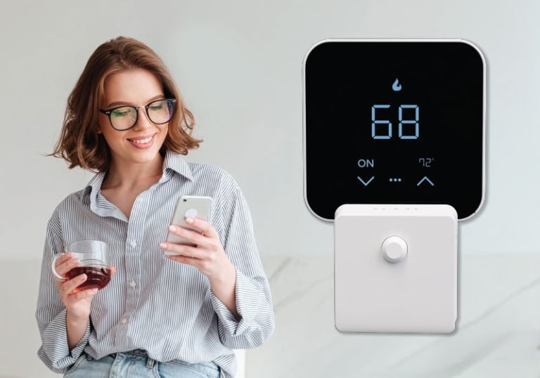 Woman using her phone app to operate the smart thermostat