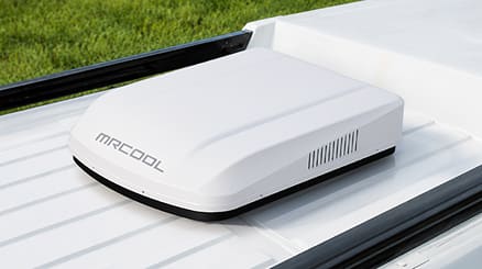 White TravelCool condensing unit installed on an RV roof