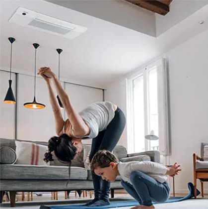 Woman doing yoga in living room with ceiling AC