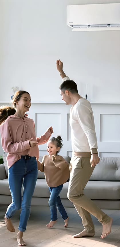 Family dancing together in living room